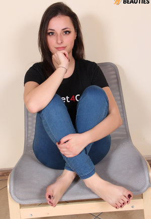 30 plus businesswoman Carlita Johnson removes her work clothes in the study